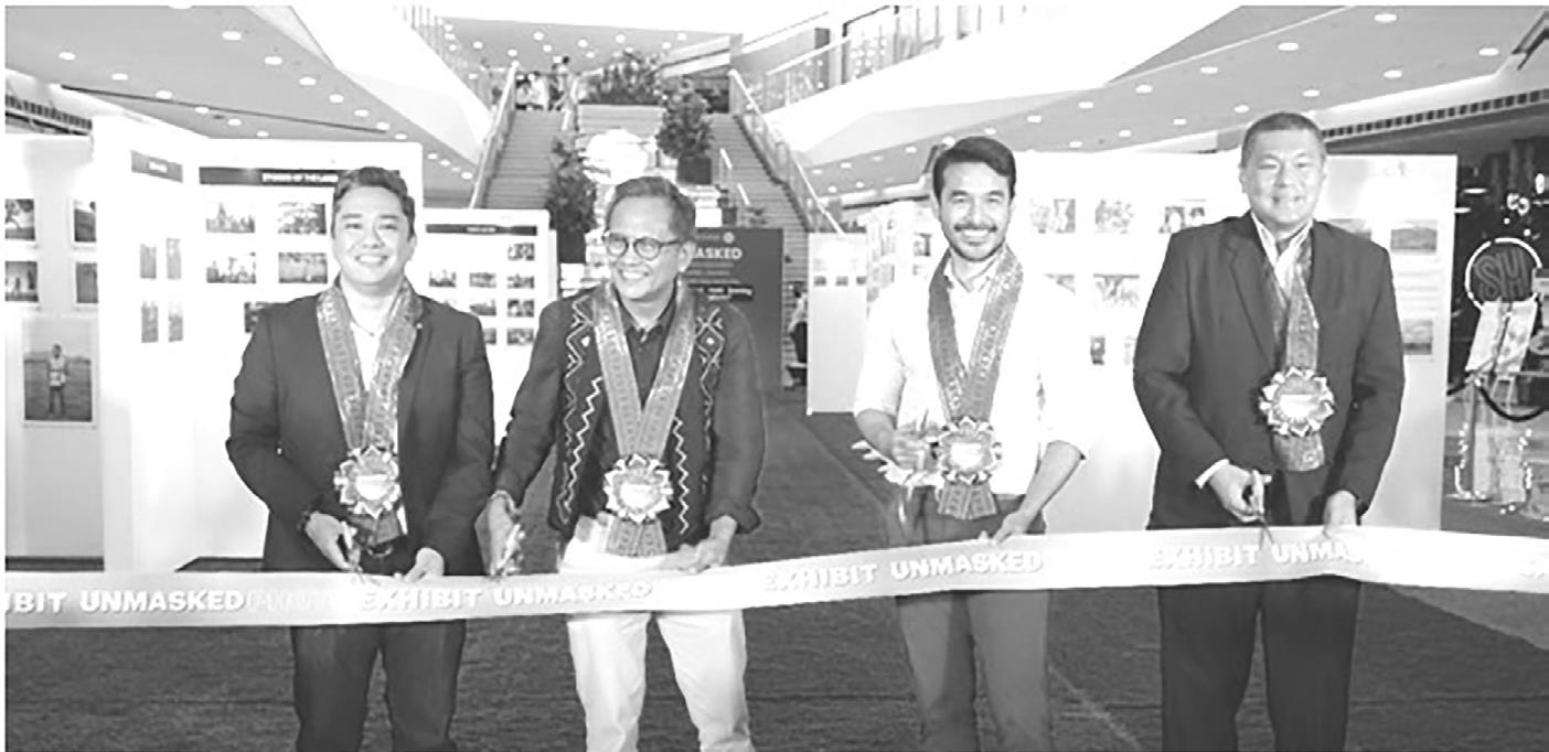 During the ribbon cutting of Unmasked: An exhibit of photos from the field by Howie Severino, Atom Araullo From left to right: Patrick Cesar Ballesteros